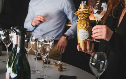 A refined gathering with people enjoying a champagne tasting in Aÿ-Champagne, France.