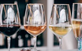 a group of wine glasses sitting on top of a table