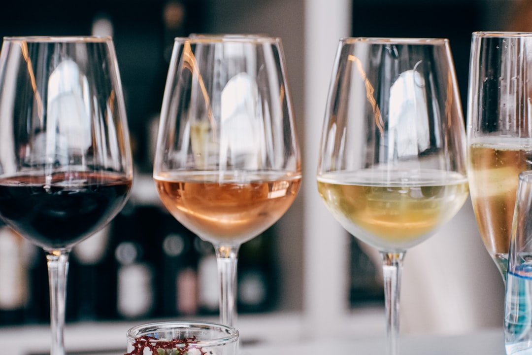 a group of wine glasses sitting on top of a table