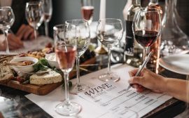 Elegant wine tasting event with cheese platter and detailed tasting notes for a refined experience.
