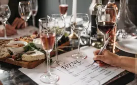 Elegant wine tasting event with cheese platter and detailed tasting notes for a refined experience.