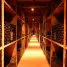 A long narrow room filled with lots of bottles